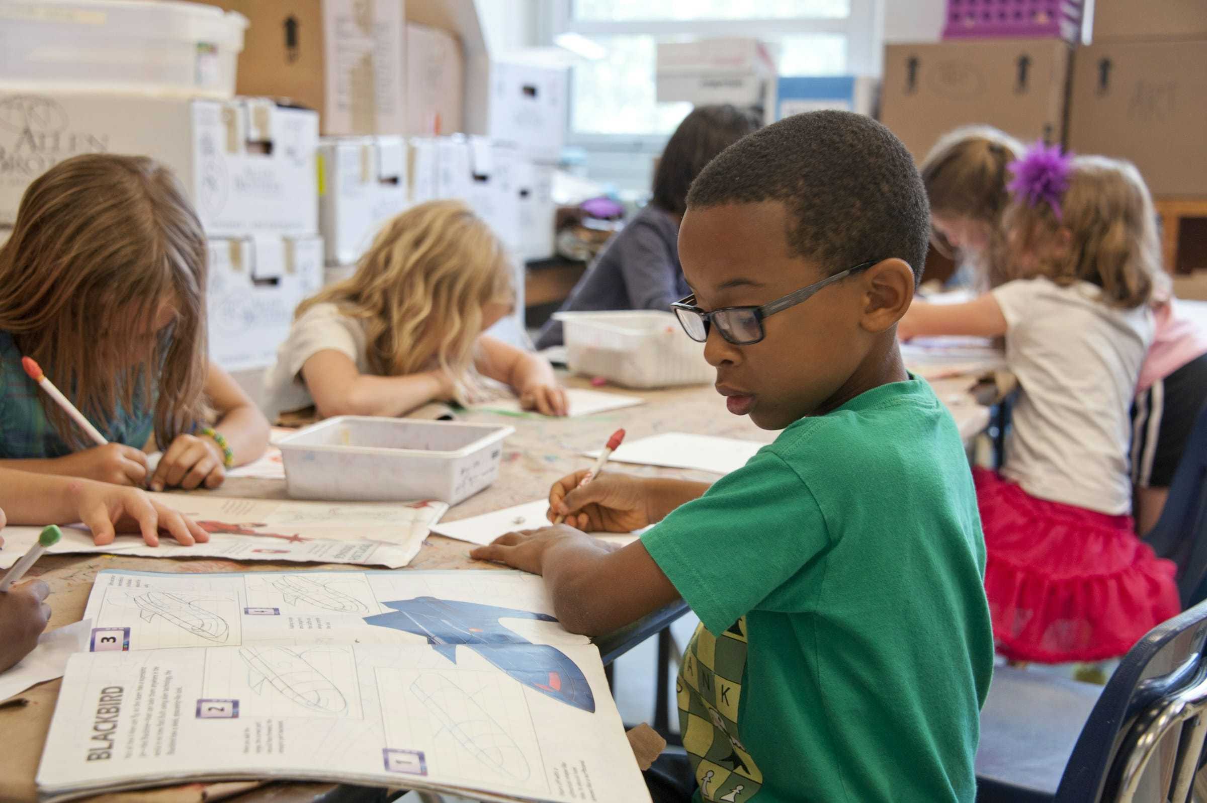 Pupils working in a primary-school classroom
